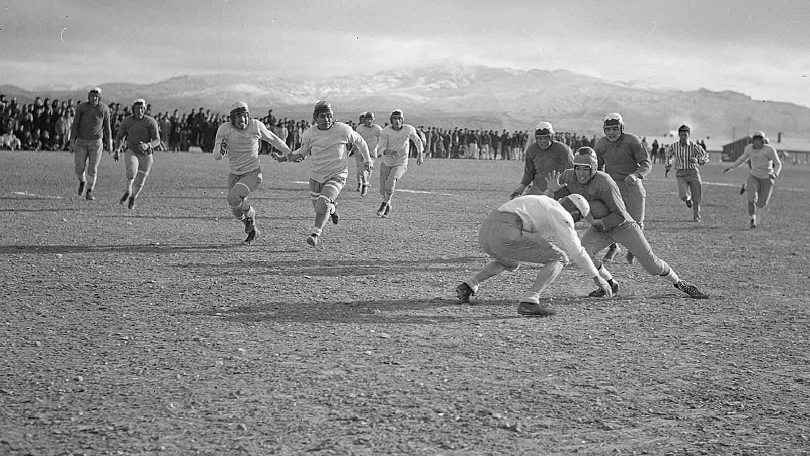 A Heart Mountain player braces for a hit during a game at the camp.