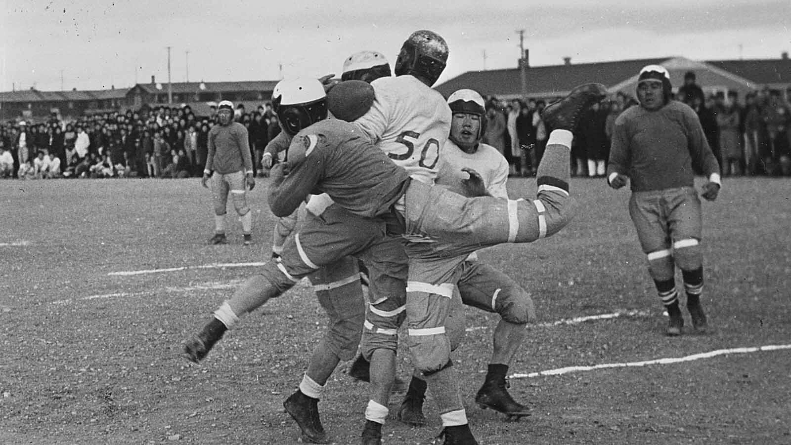 A jumble of players fight for the ball during an inter-camp game.