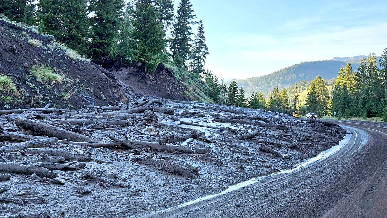 A mudslide spills out across Highway 14/16/20 less than five miles east of Yellowstone's East Gate on Tuesday.
