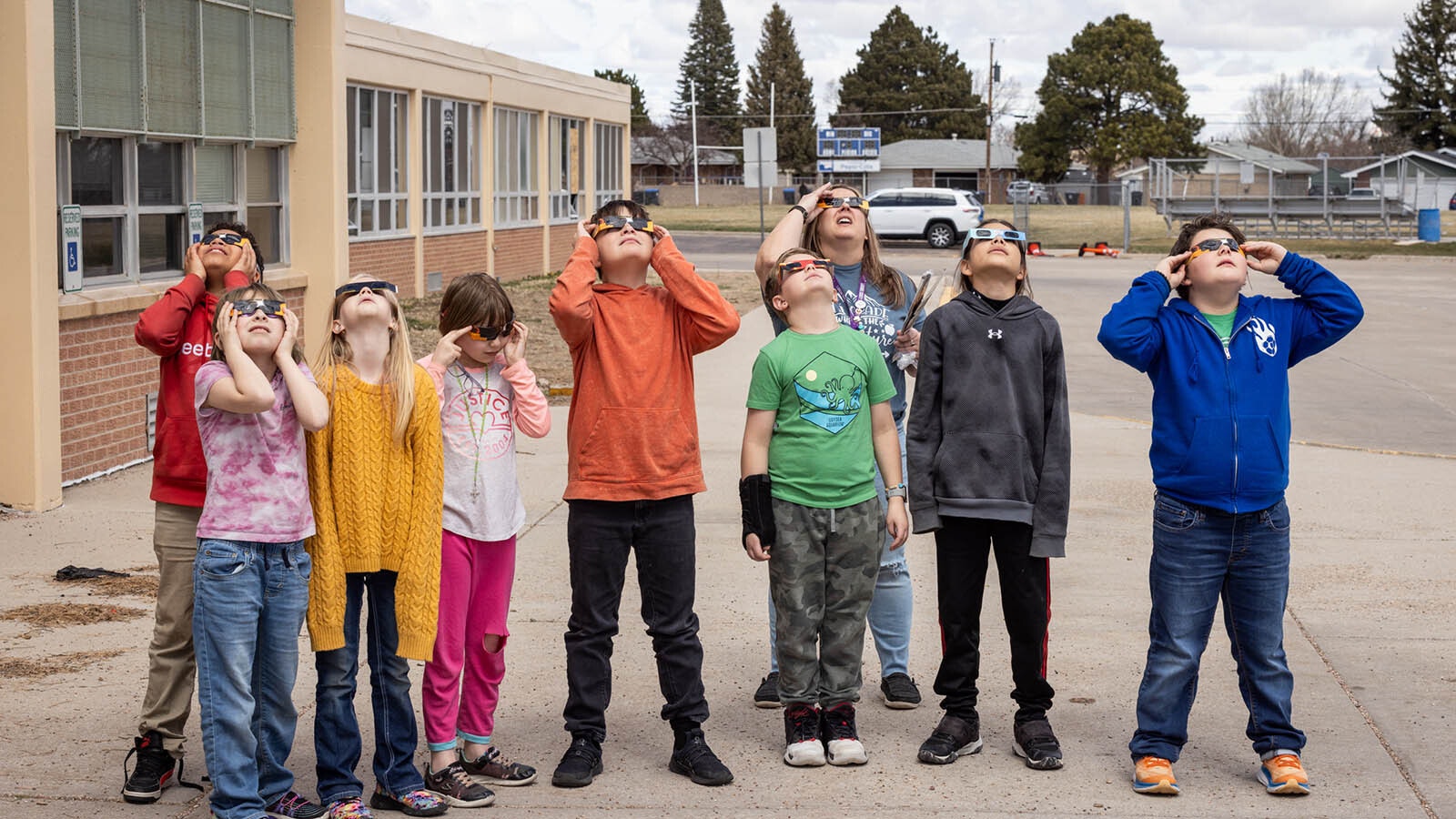 Fourth grade students at Arp Elementary School view the eclipse in Cheyenne, Wyoming, on April 8, 2024.