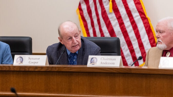 State Sen. Ed Cooper (left) is retracting a statement he made about the Freedom Caucus hinging campaign donations to its local members based on their voting records