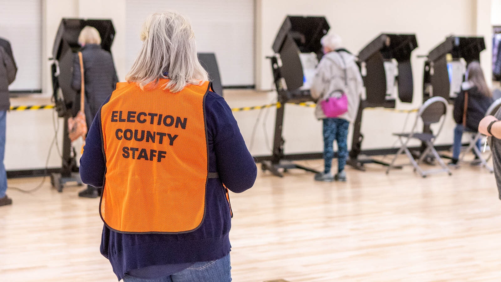 A Laramie County election worker monitors voting in Cheyenne during the 2022 general election.