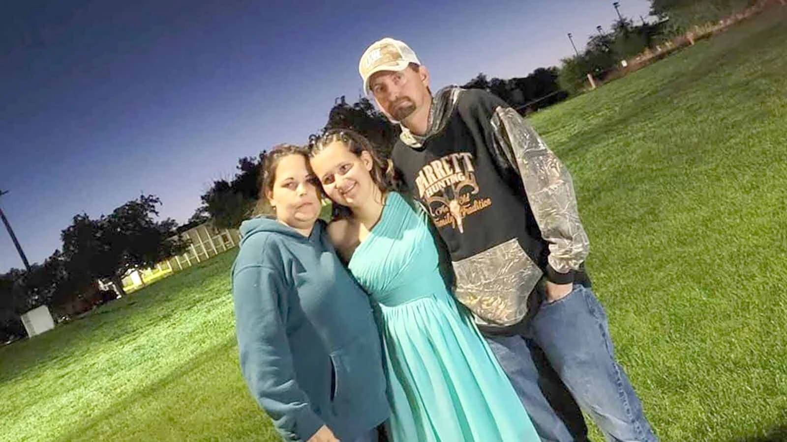 Lizzy Barrett's parents, Shara and CJ, pose with the now-missing 17-year-old.