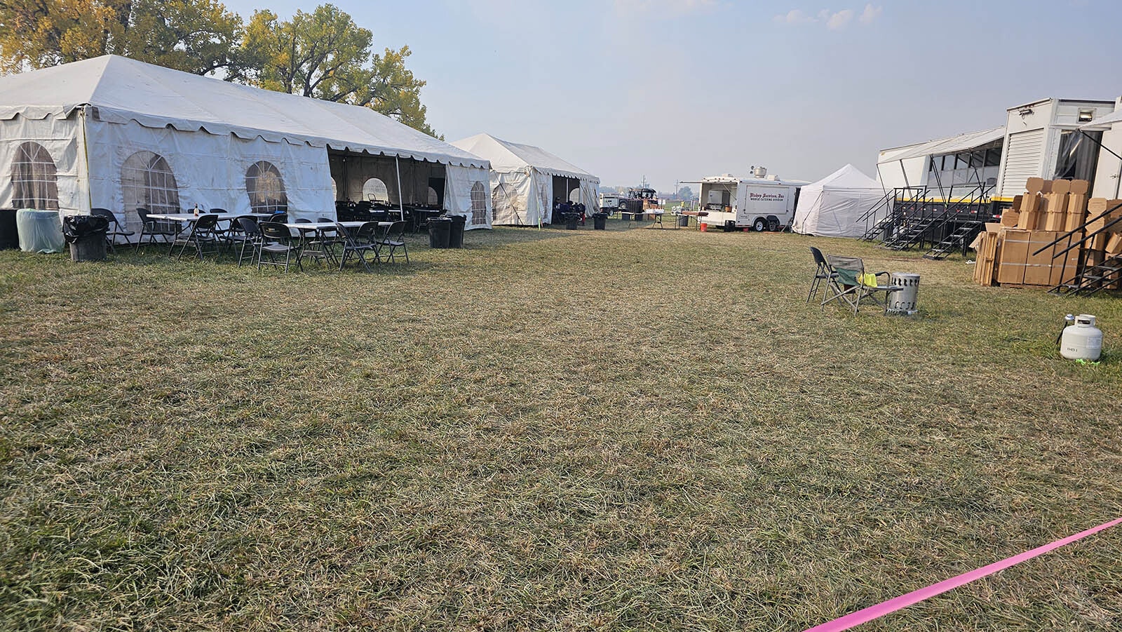 The cafeteria alley, where the mess hall and cook shacks are located. At the far end is a coffee, water station that is available all day.