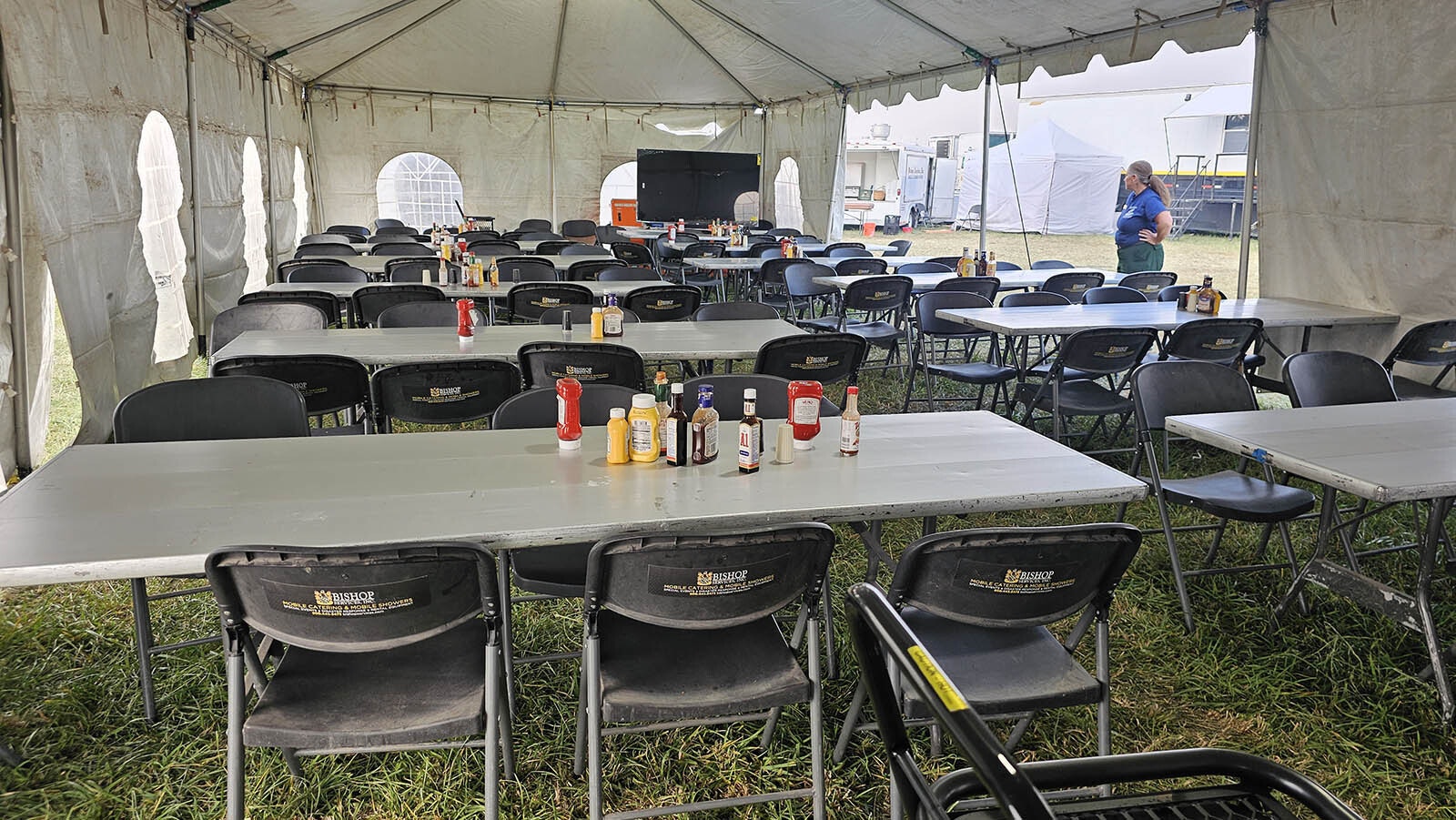 The mess hall. Each table has condiments to share.