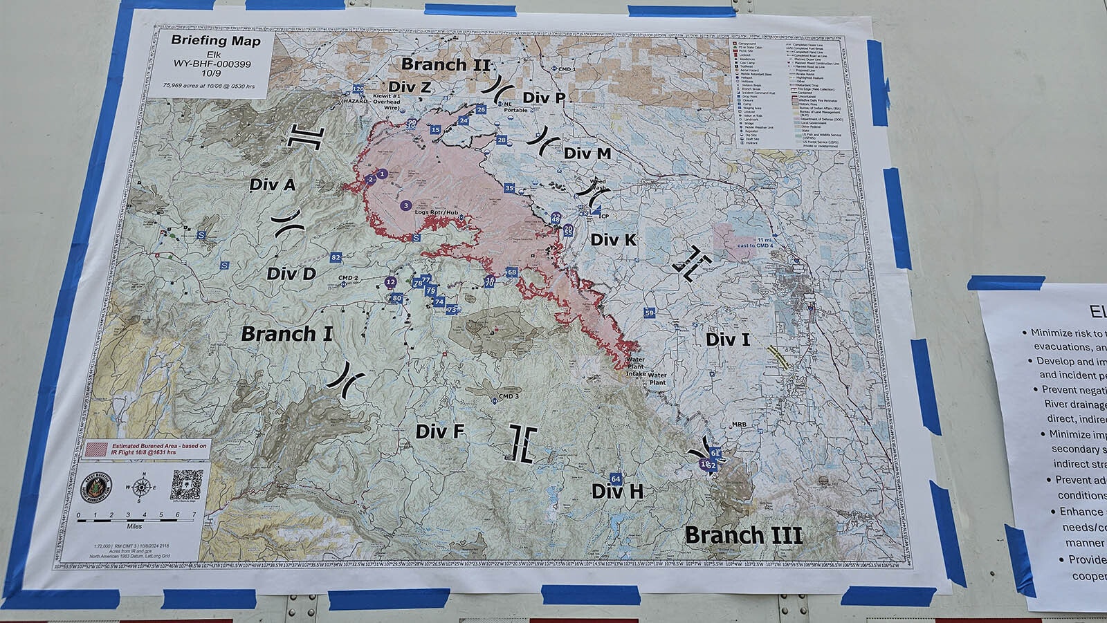 This briefing map is almost as tall as a semitrailer.