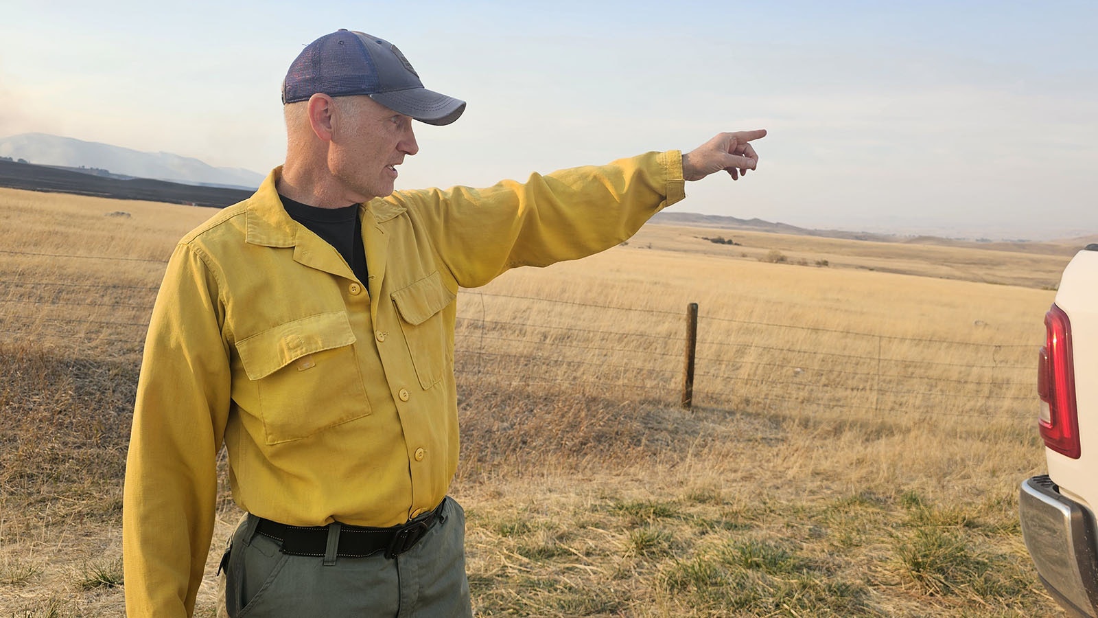 Mike De Fries gestures toward Big Horn as he talks about the Elk Fire preparations along Red Grade Road.