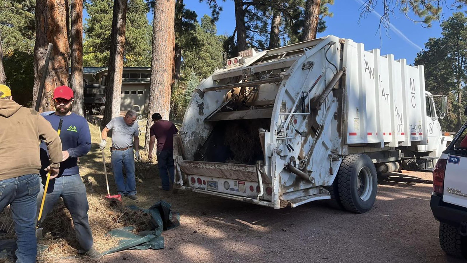 An MC Sanitation driver agreed to let Story residents load debris directly into his garbage truck after four roll offs filled up.