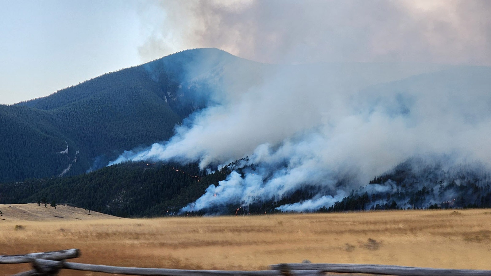 Crews from the Tongue River Fire Distict work to protect people and property from the Elk Fire.