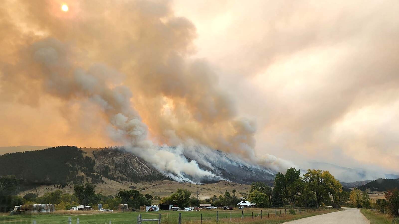 The Elk Fire burns down the face of the Bighorns over Dayton, Wyoming.