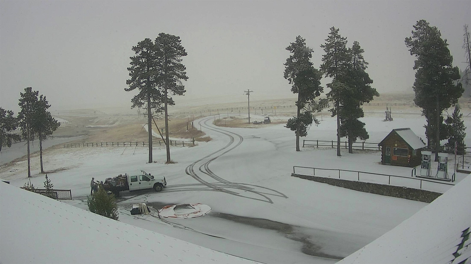 This image from the Bear Lodge Resort webcam in the Wyoming Bighorns shows the arrival of much-anticipated snow. The lodge is near the Elk Fire, which has grown to about 96,000 acres.