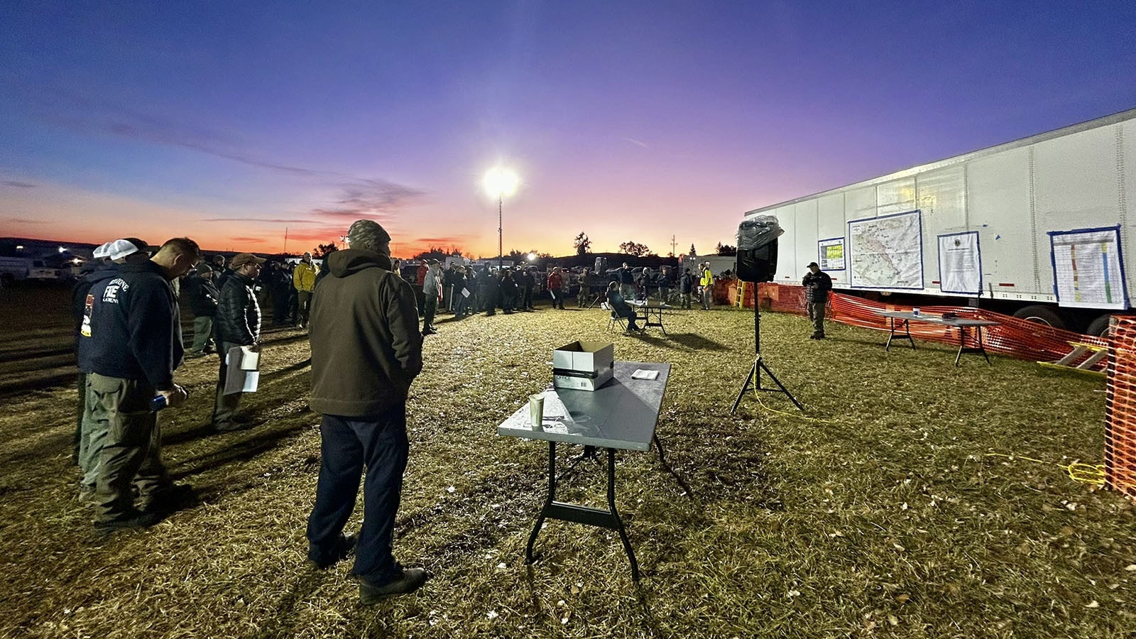 Firefighters gather before dawn Sunday for a briefing on the Elk Fire before going out to fight the fire.