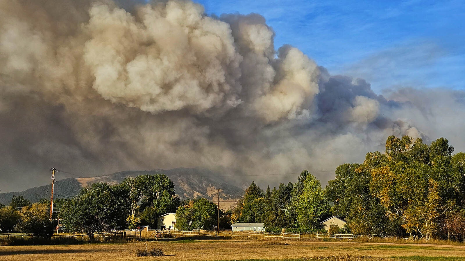 The small, rural Wyoming town of Dayton sits at the bottom of the Bighorns where the Elk Fire burns across the mountain face.