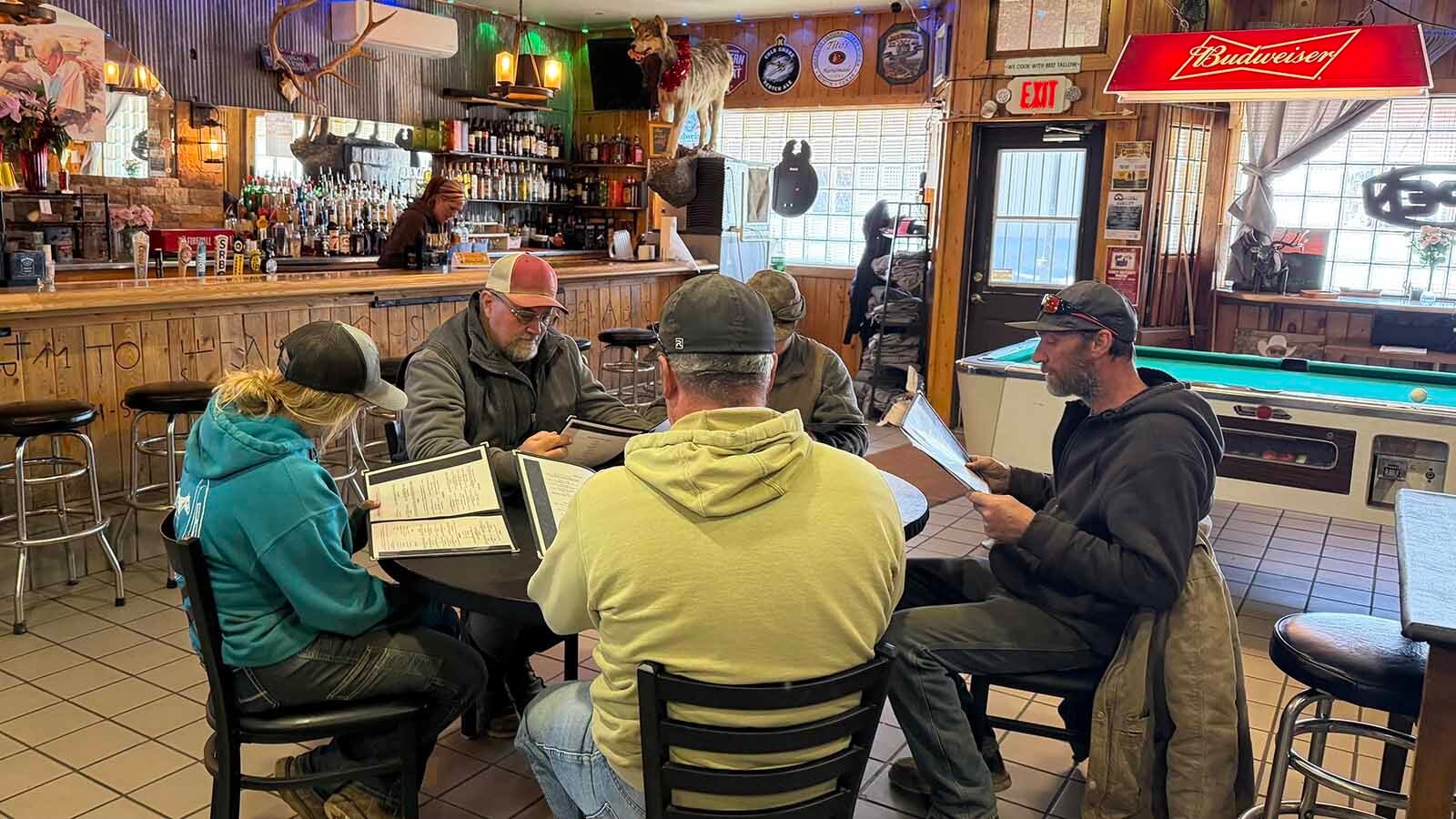 The Elkhorn Bar & Grill in Meeteetse was built in 1947 and during the past eight decades has continued to serve locals and tourists. Kelsey Scolari had bought the bar which her grandparents had run from 1994 to 2015 and said that she offers a place for lunch during the day and a bar at night, keeping the legacy of her grandparents alive.