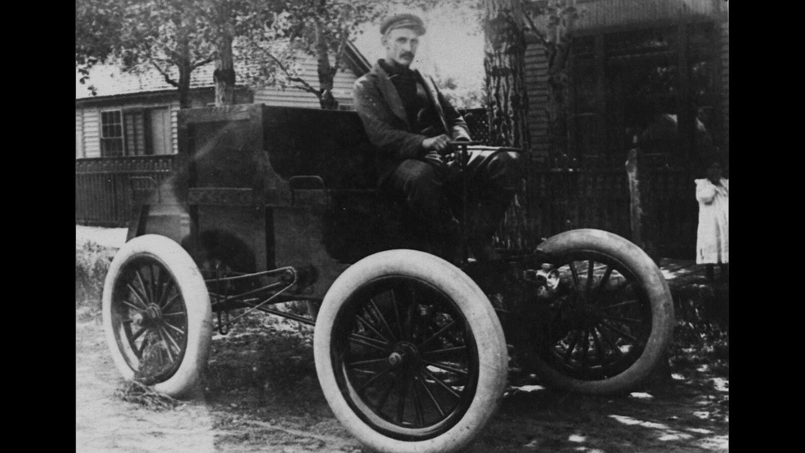 Elmer Lovejoy in one of his automobiles.