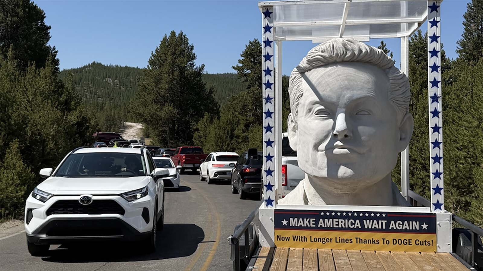 A giant 12-foot-tall Elon Musk head hauled on a flatbed trailer behind a pickup is making the rounds through national parks, including Yellowstone. It’s sparking praise and alarm about what it represents on federally protected land. Here it's rolling through Yellowstone.