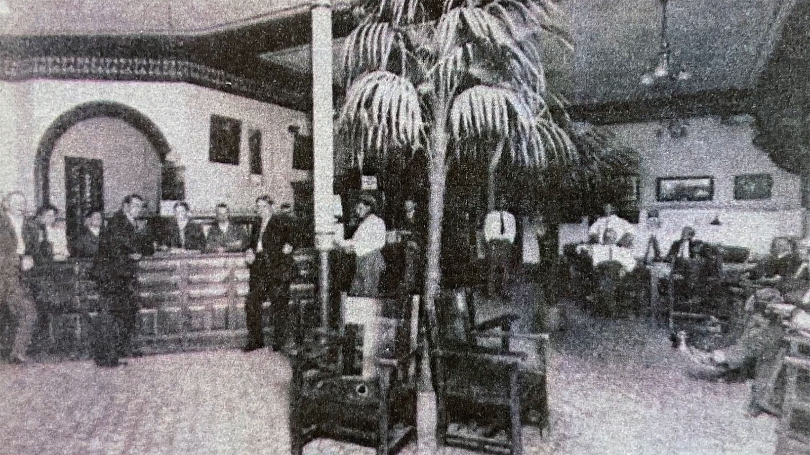 The lobby of the Emery Hotel circa 1910, complete with tropical plants.