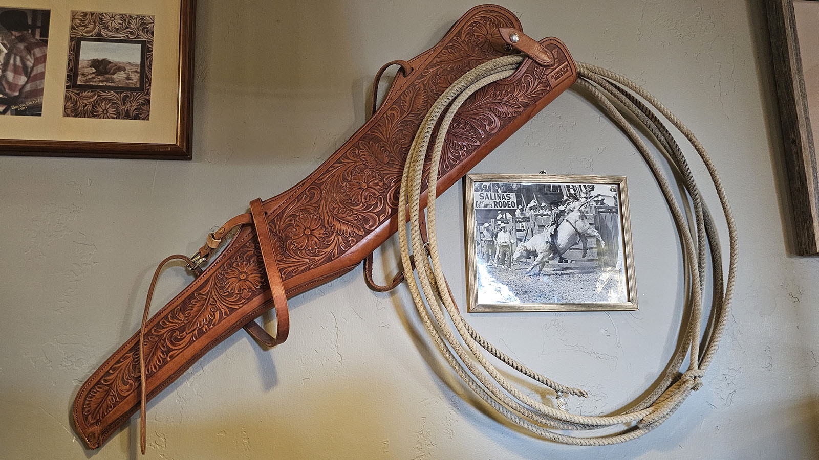 A leather scabbard carved by professional rodeo rider Eugene Bechtel, who was a family friend.