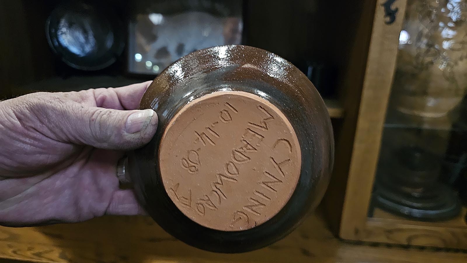 The bottom of a pottery bowl made by Cyning Meadowcroft.