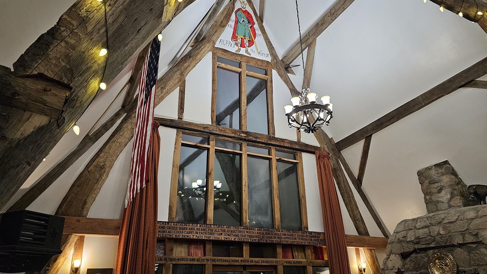 King Alfred at the top of Cyning Meadowcroft's medieval-style, cruck-constructed home in Happy Valley.