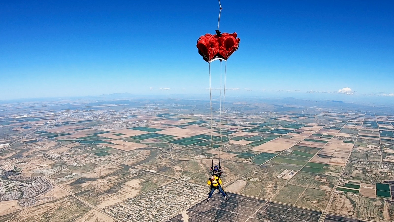 Ernie Herrera pulls his parachute during his first skydiving jump.