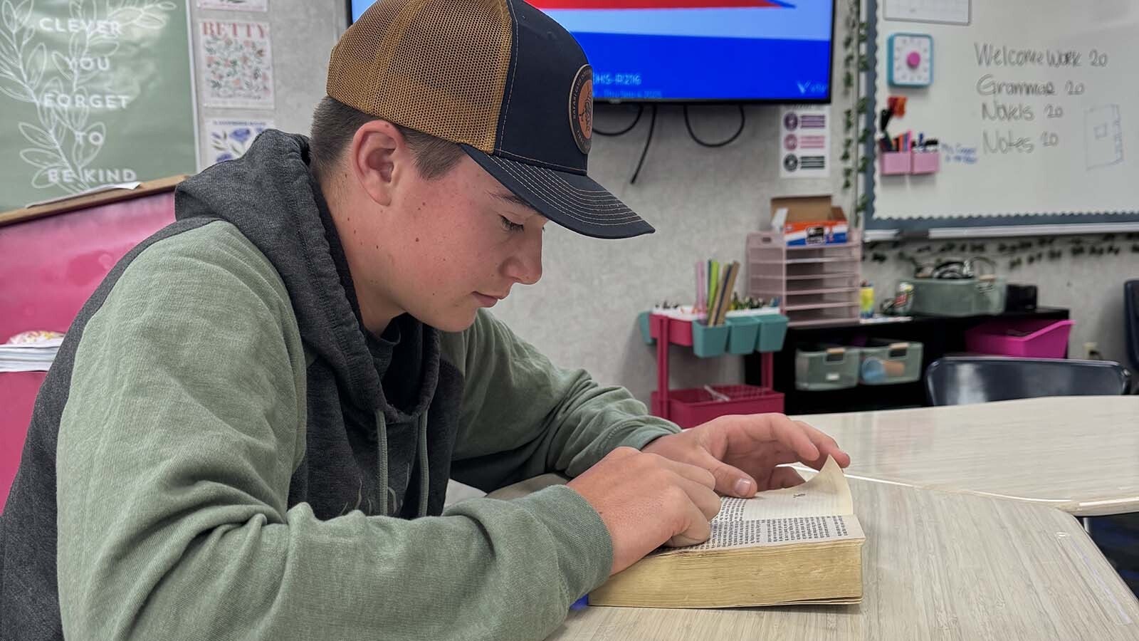 Evanston High School sophomore Hayden Hasler rediscovers books after his school implemented a cellphone ban for the 2025-26 school year.