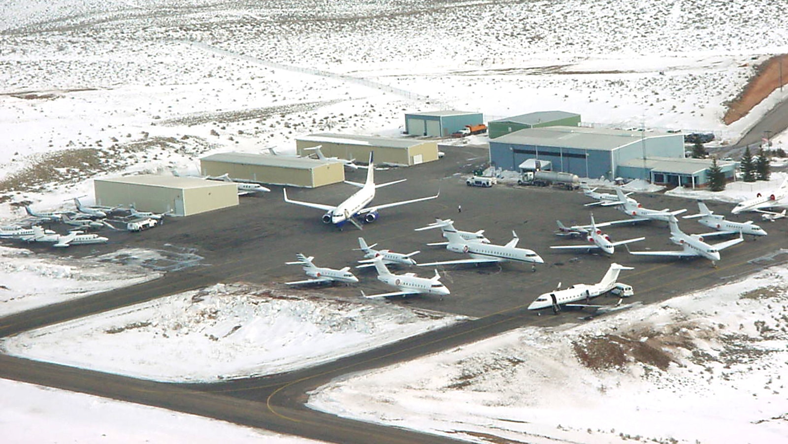 A variety of private jets are parked at the Evanston, Wyoming, airport in February 2002 during the Salt Lake City Winter Olympics.