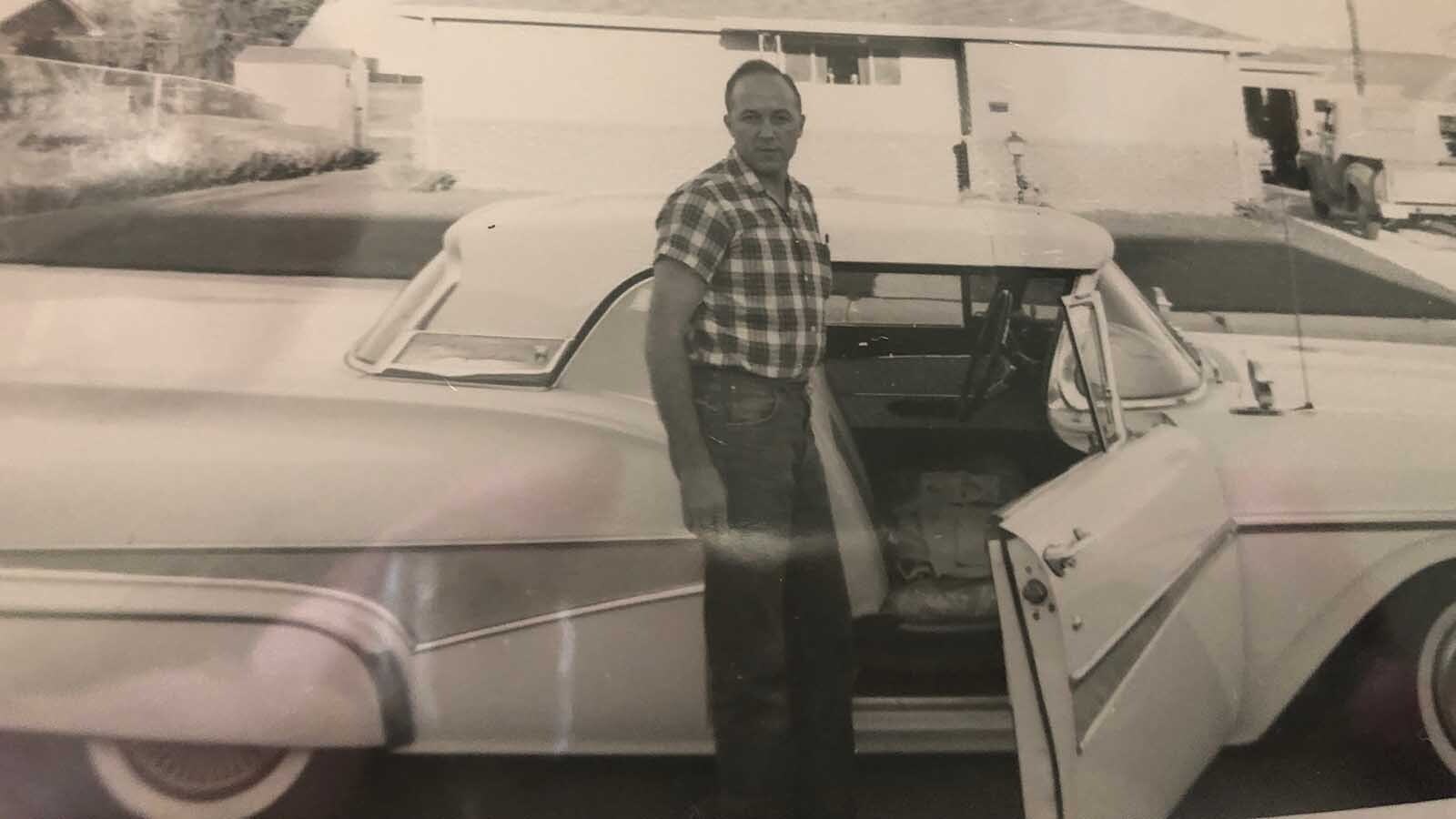 Everett Mann poses with a car. He said he always enjoyed working on cars as well as doing woodworking.
