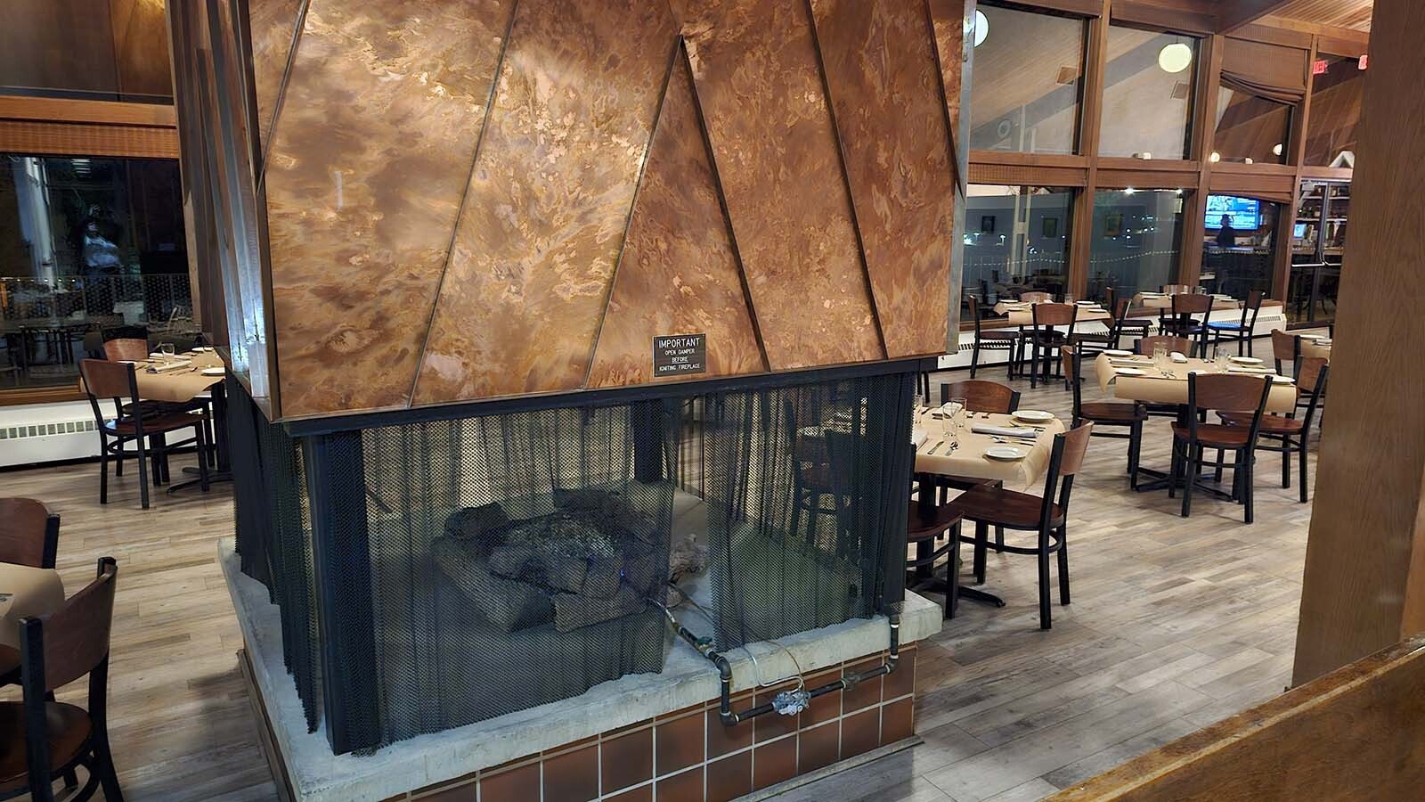 A huge coppery fireplace in the center of the restaurant makes the space feel cozy in winter.