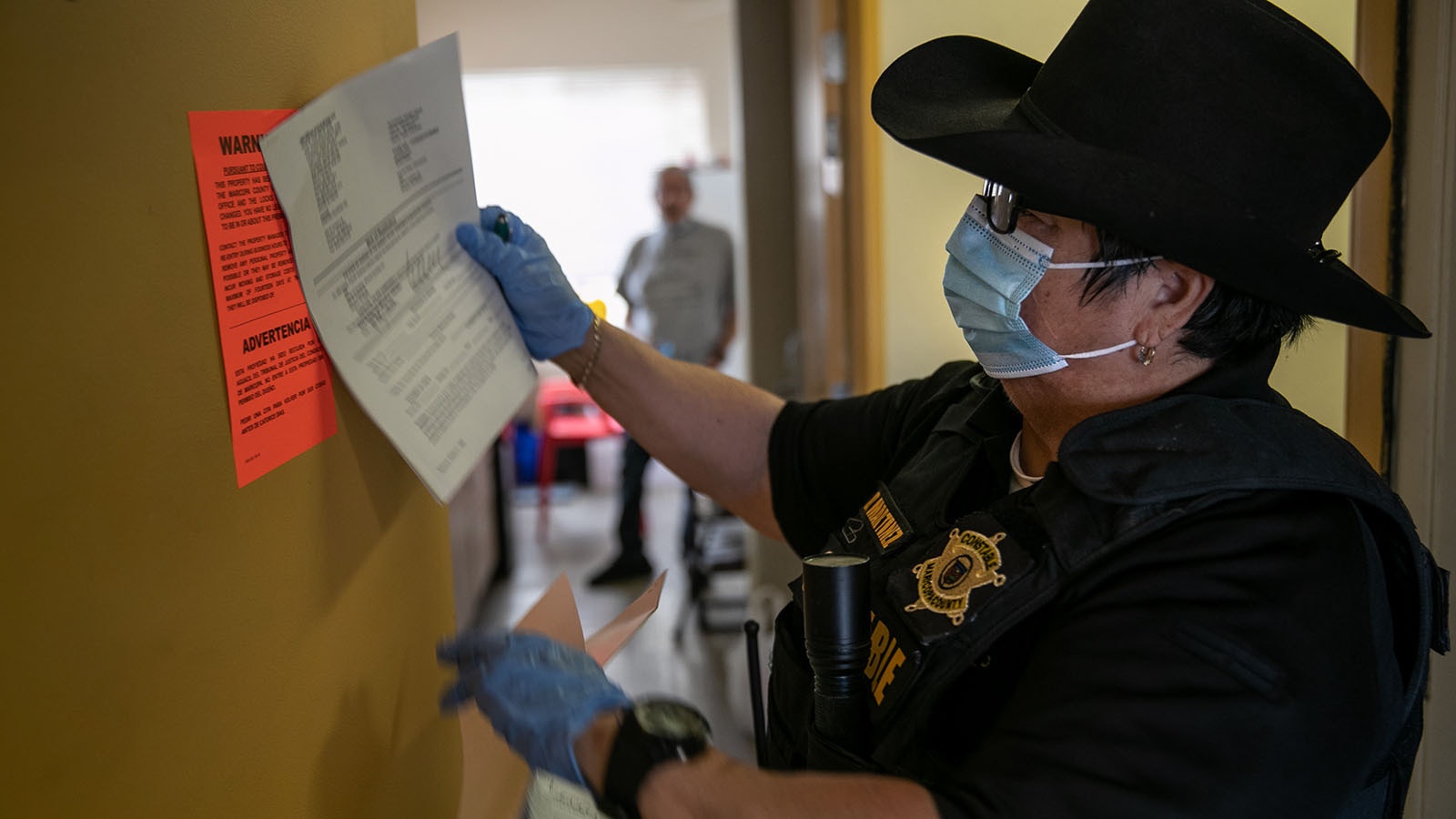 File photo: Officer posts eviction notice