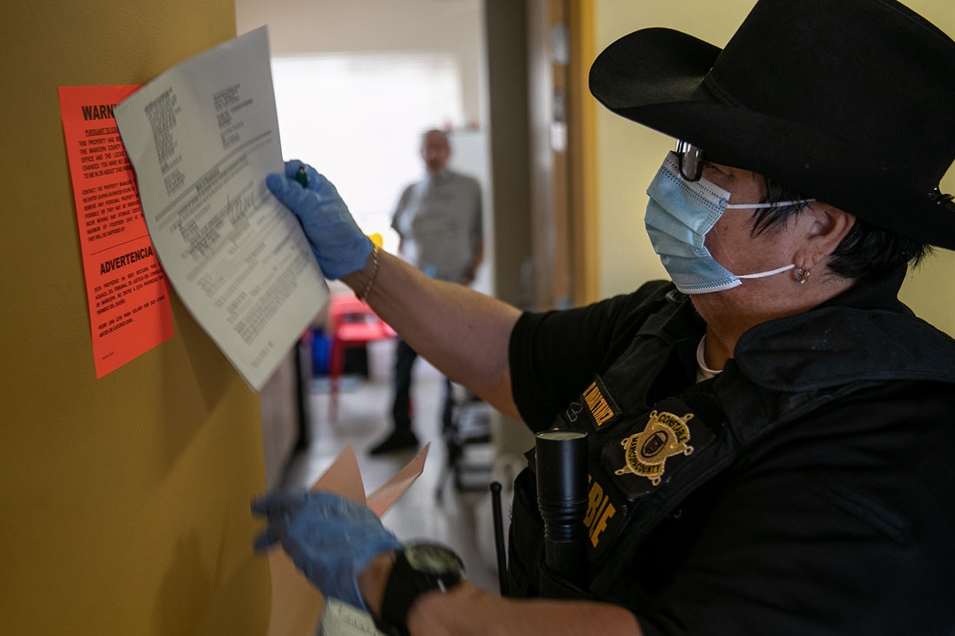 File photo: Officer posts eviction notice