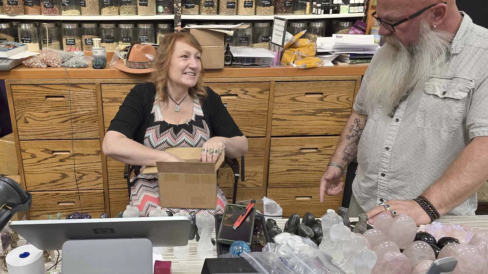 Patricia Miller, with her husband Tim, unpacked new merchandise at the Twinkle, Twinkle Little Store at the Frontier Mall. Patricia recently had a customer try to pass of a counterfeit $100 bill.