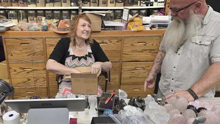 Patricia Miller, with her husband Tim, unpacked new merchandise at the Twinkle, Twinkle Little Store at the Frontier Mall. Patricia recently had a customer try to pass of a counterfeit $100 bill.