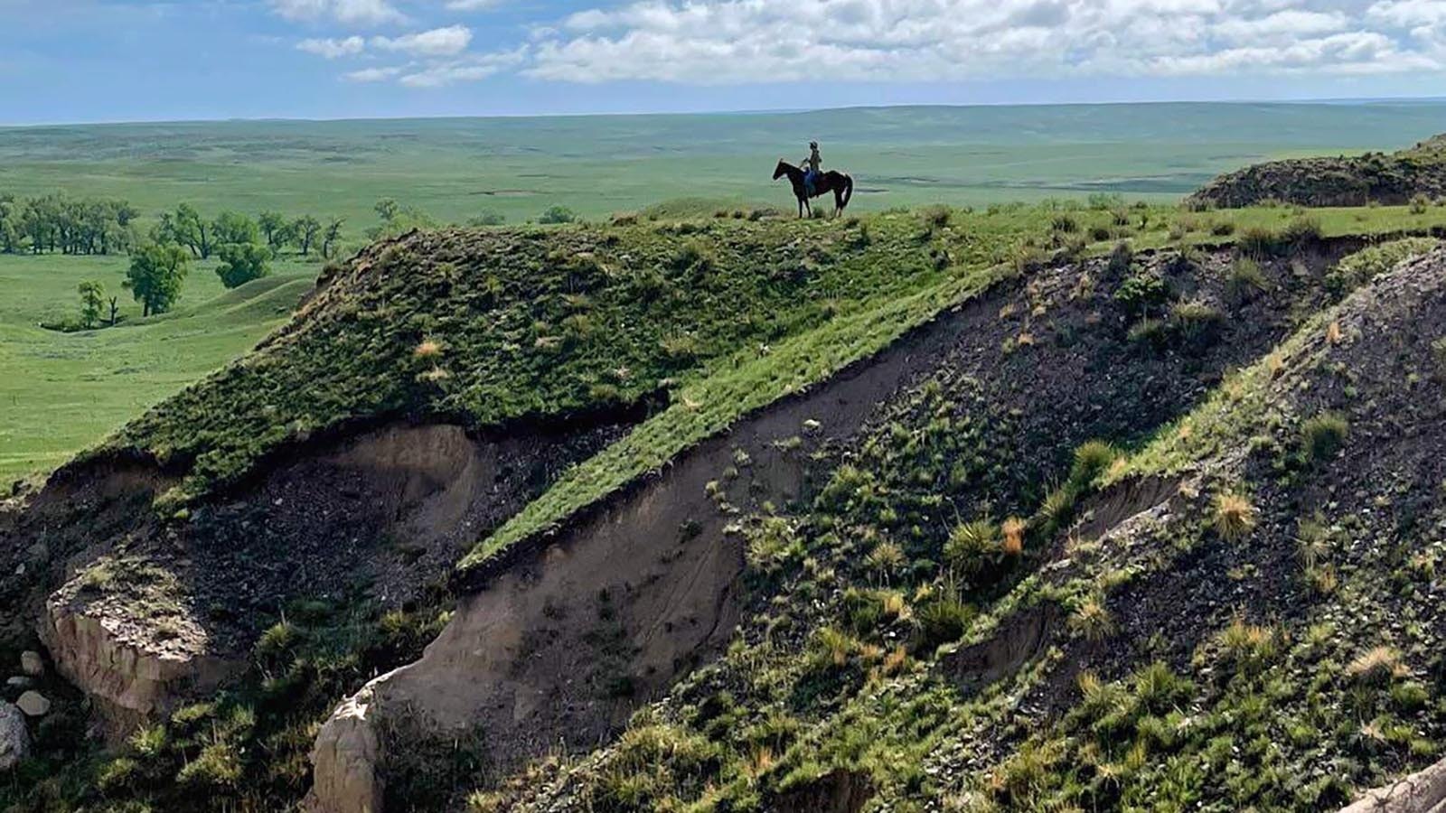 Mother Featherlegs arrived in Wyoming in 1876 and opened a roadhouse to accommodate the stagecoaches running between Cheyenne and Deadwood. Her house of entertainment, no more than a rude dugout, was successful until her murder in 1879. The scenery around her grave remain much the same as it did in the late 1800s.