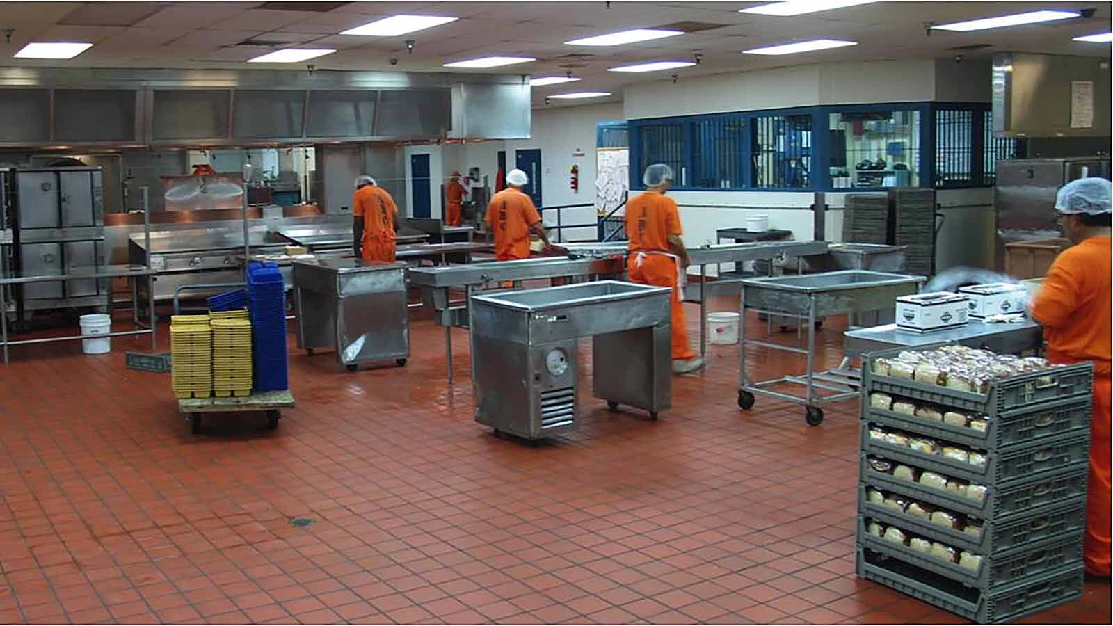 The maximum-security kitchen staffed each day by inmates bused in from lower-security yards.