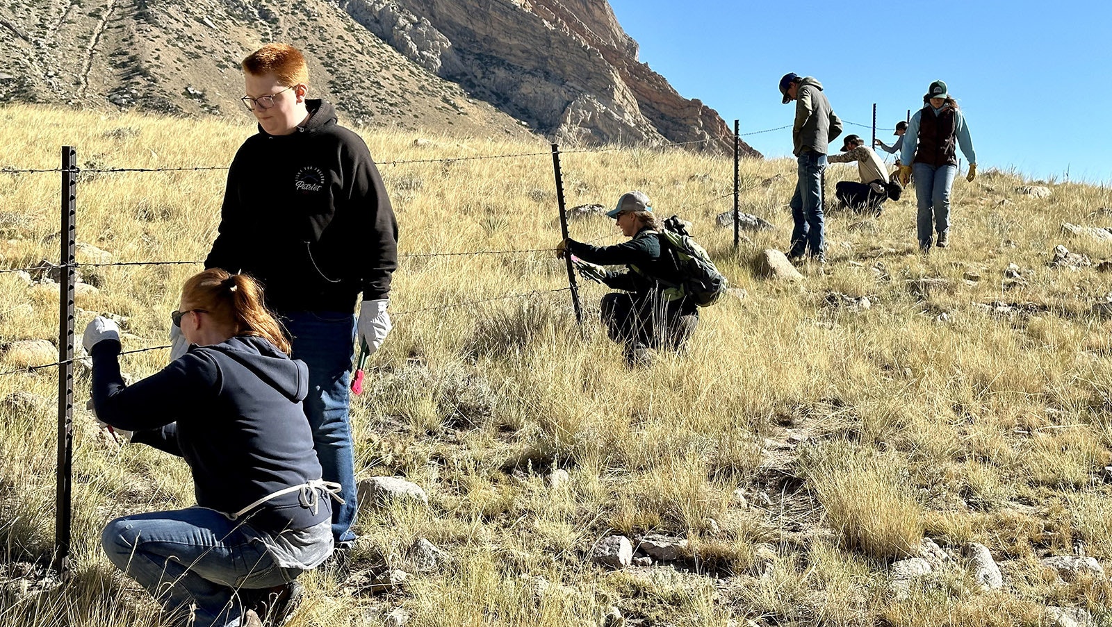 Volunteers of all ages in the Clarks Fork Canyon. Since the Absaroka Fence Initiative started in 2020, over 25 miles of fencing in Park County has been removed or modified. Over 2,000 volunteer hours have been donated to make this progress possible.