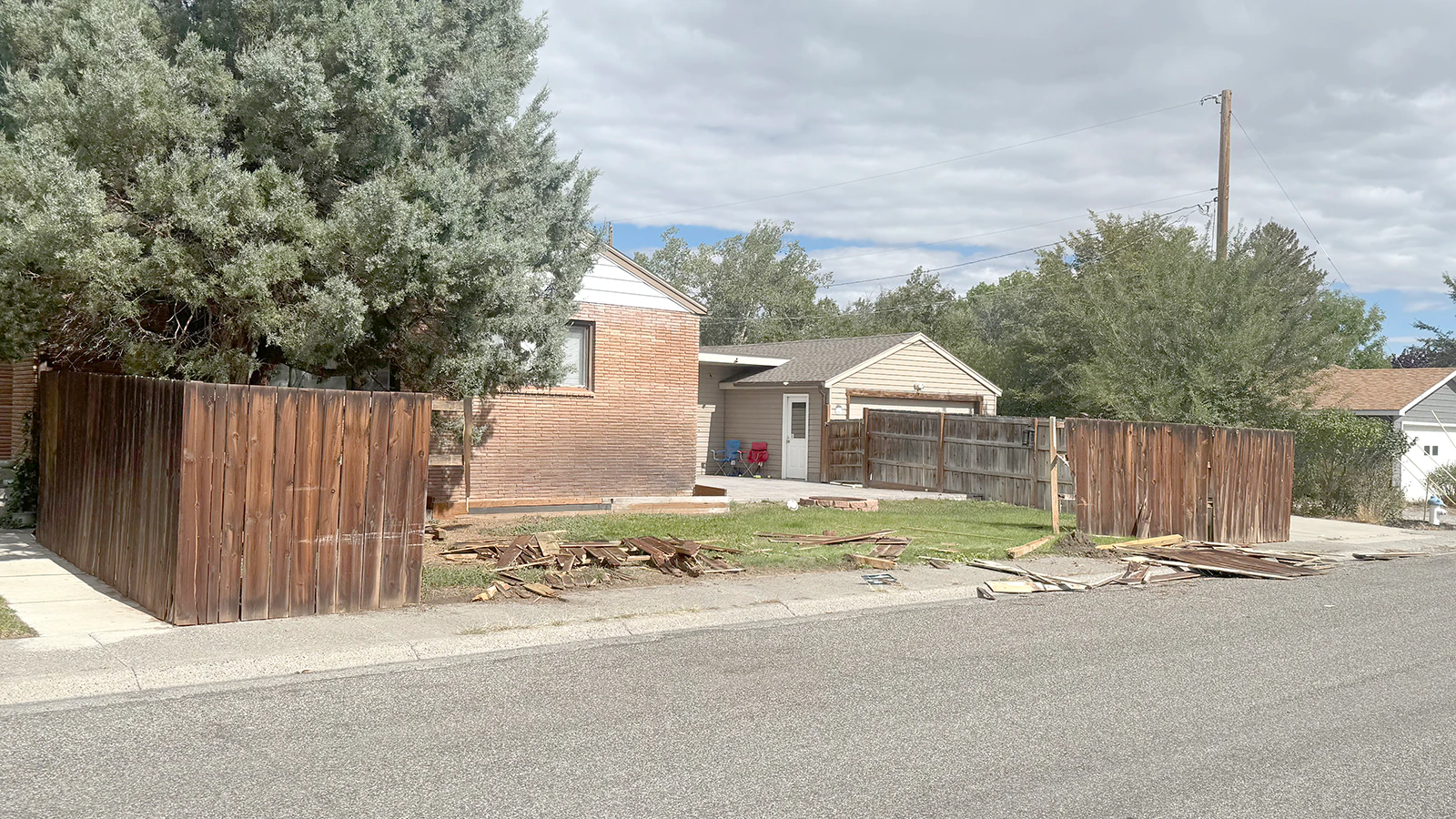What's left of the wooden fence around a Cody home's backyard after a hit-and-run driver took it out just after midnight Wednesday, Sept. 23, 2026.