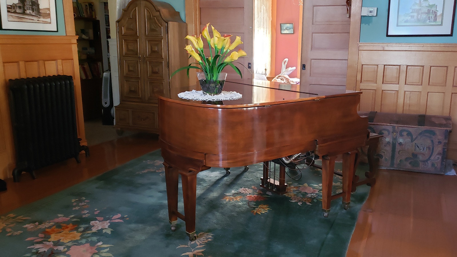 A turn of the 20th century player piano. It doesn't work, but is still a beautiful centerpiece in the foyer of the Ferris Mansion.