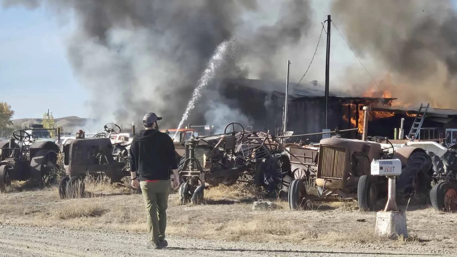Fire tears through Rick and Steva Dooley’s shop outside Basin on Oct. 3 as crews work to contain the blaze. The couple had operated their diesel injection business from the property for more than four decades.