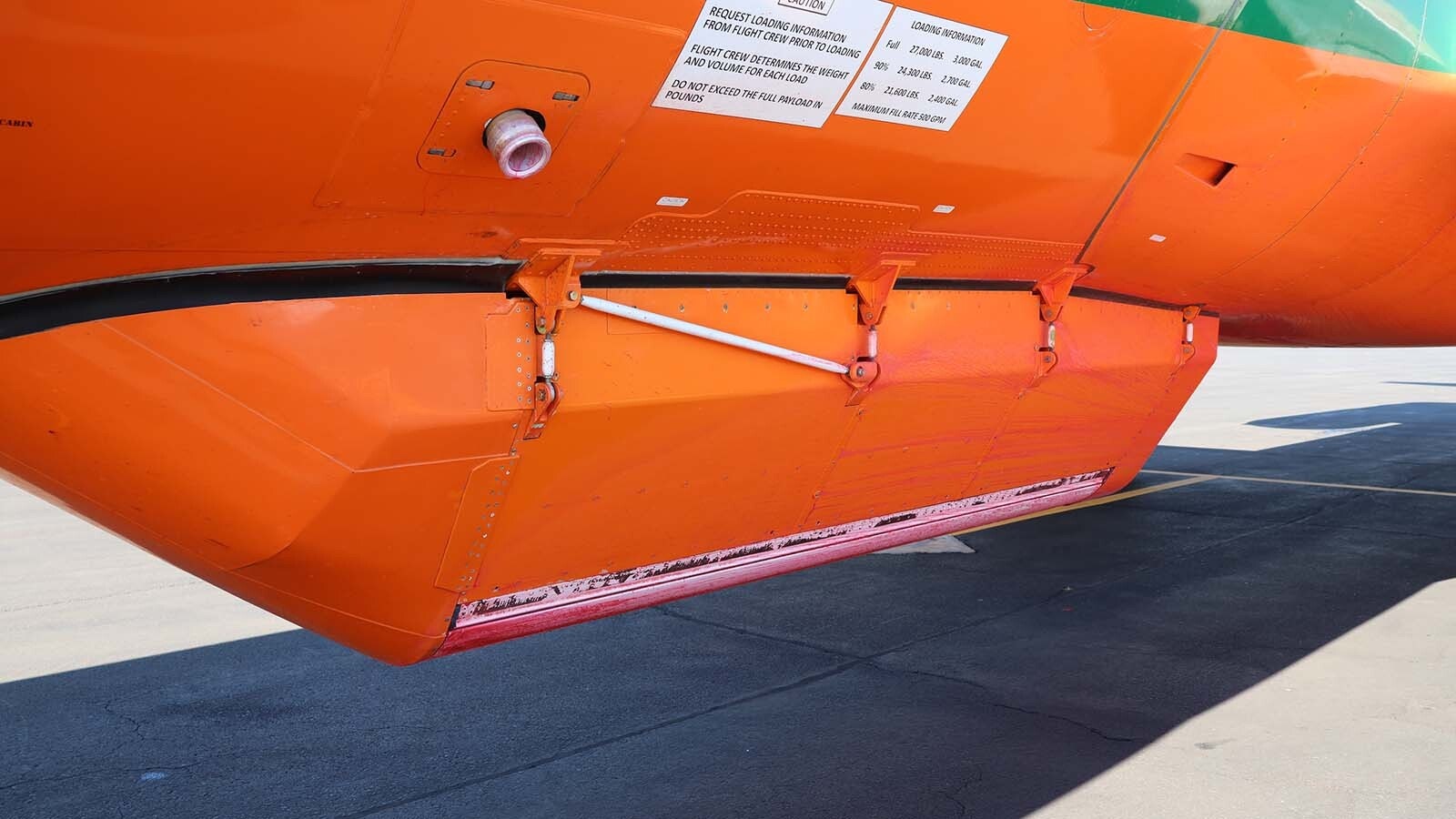 The spray pod installed on the belly of the MD-87 is computer operated and can dole out fire retardant in a light spray for grass fires or a heavy dump for heavily forested areas that require penetration of the forest canopy.