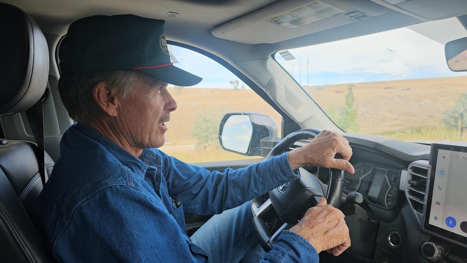 David Belus in his truck taking Cowboy State Daily on a tour of his ranch.