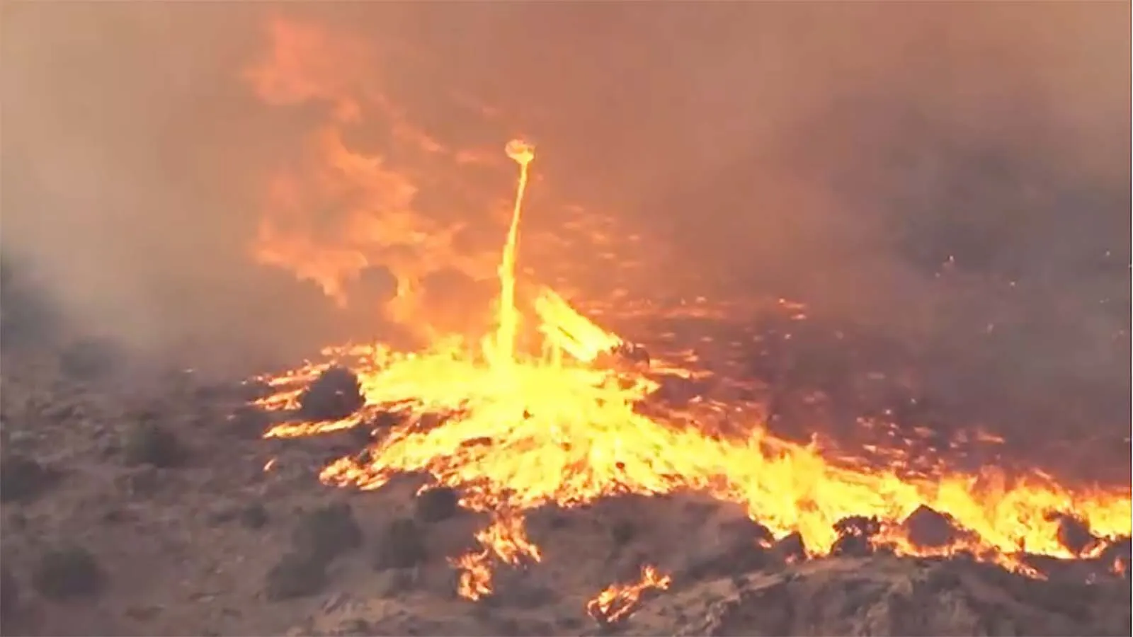 A wildfire watcher observing the Big Draw Fire in eastern Idaho on Sunday captured video of a spiraling tower of flame rising more than 100 feet into the air. "Fire devils" are created when flames reach high enough that they swirl.