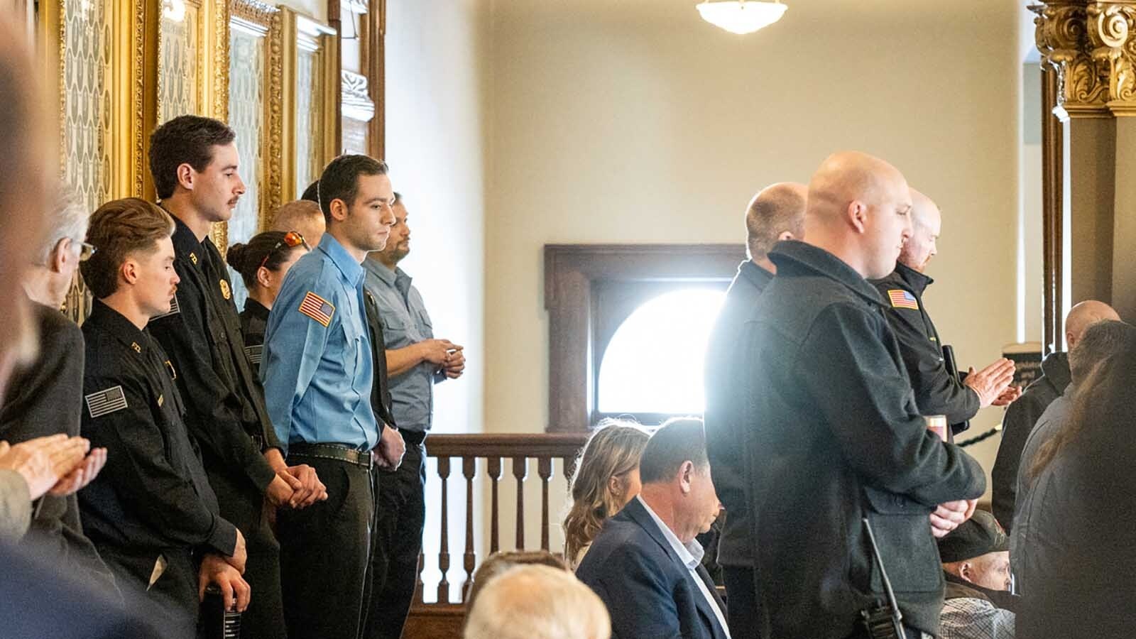 A group of Wyoming firefighters and law enforcement officers filled the state Capitol in Cheyenne on Wednesday to protest a proposed 50% property tax cut. They say it could gut the budgets of their local departments.