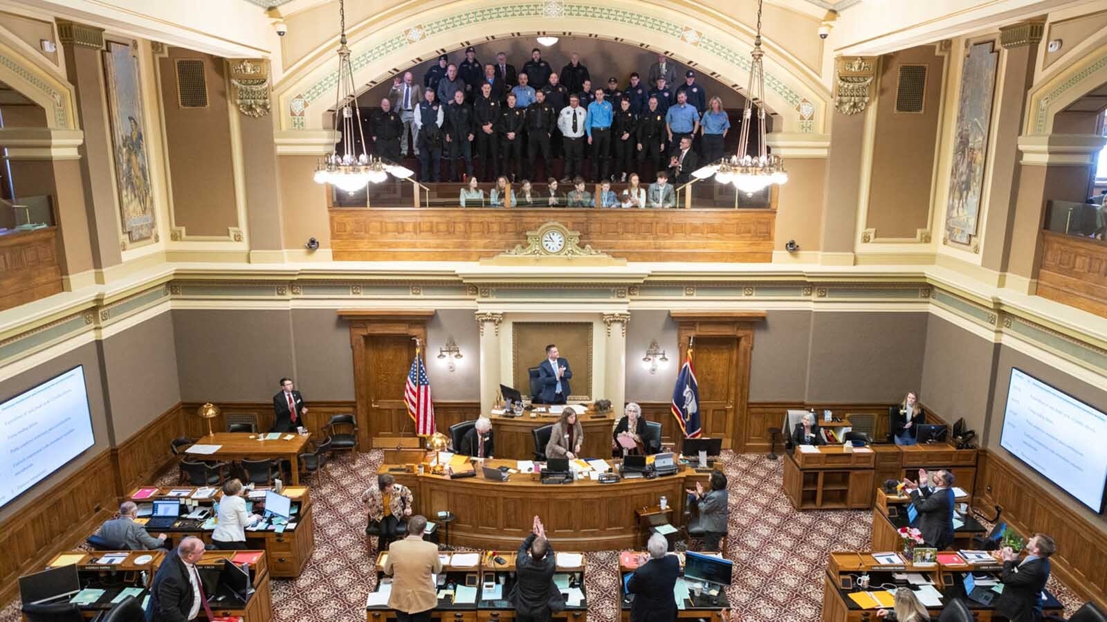 A group of Wyoming firefighters and law enforcement officers filled the state Capitol in Cheyenne on Wednesday to protest a proposed 50% property tax cut. They say it could gut the budgets of their local departments.