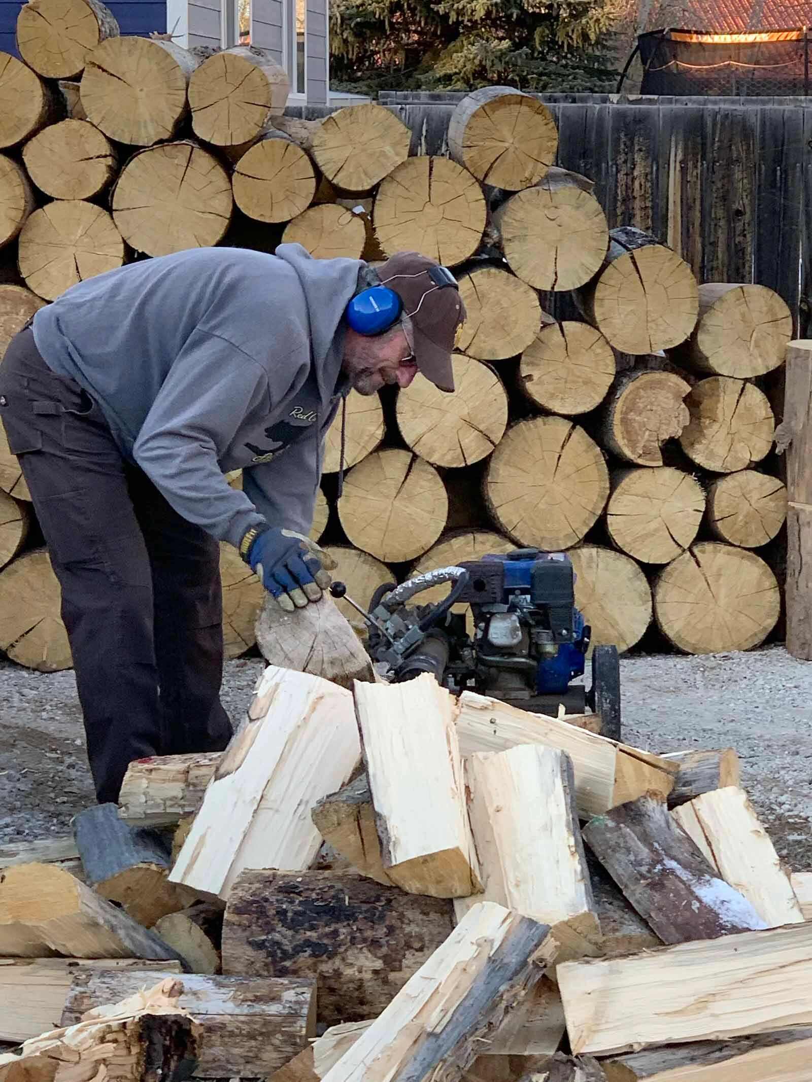 Logs are split for kindling to go into the fireplace.
