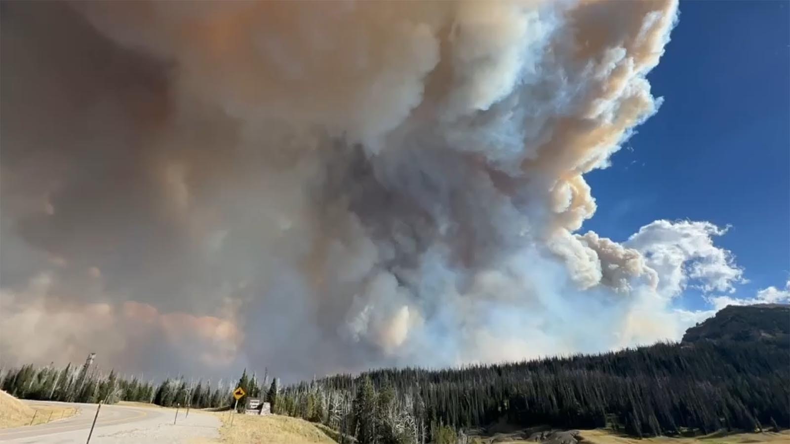 A huge plume of smoke rises from the Fish Creek Fire in northwest Wyoming.