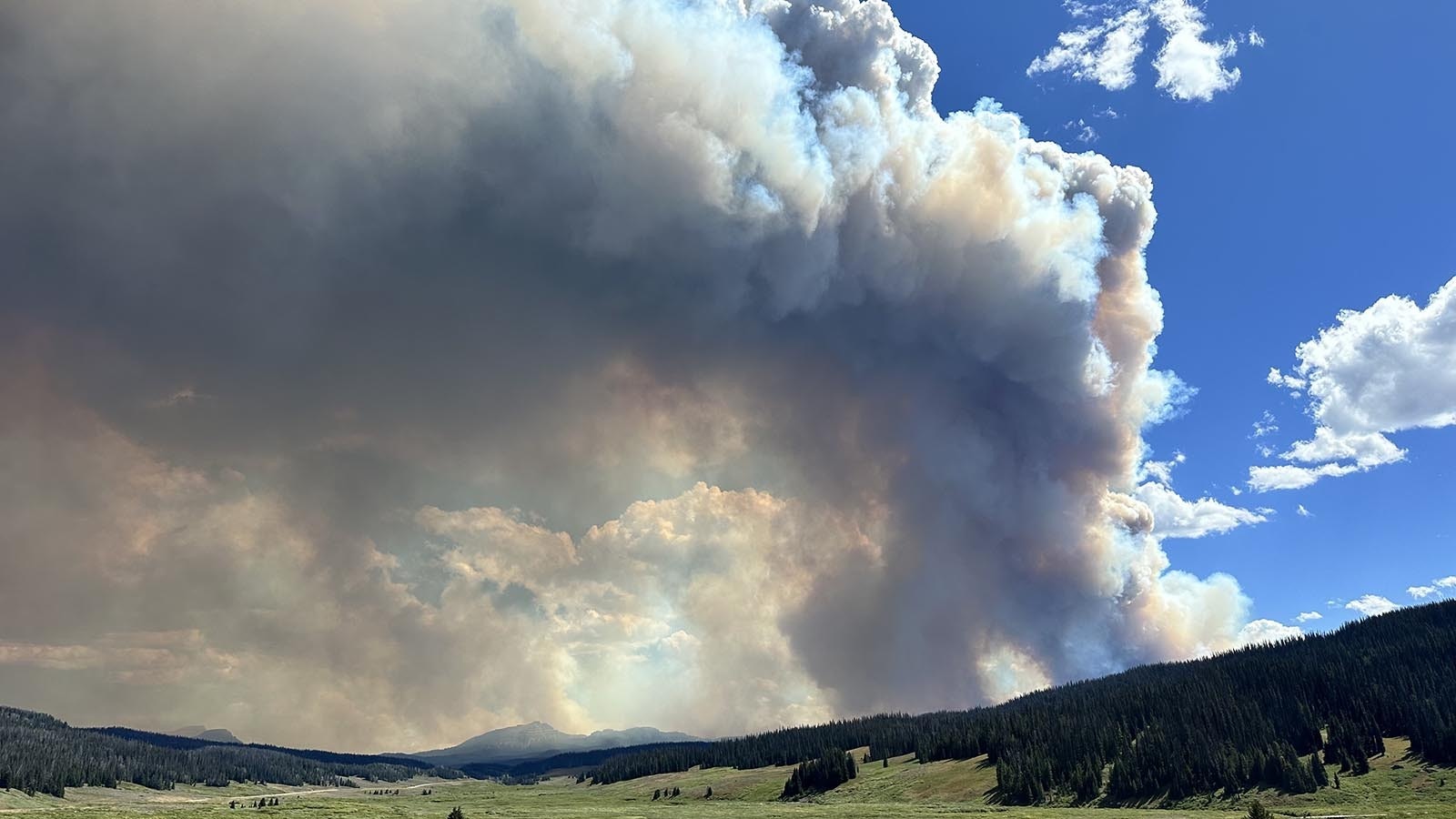 Smoke churns from the Fish Creek Fire, which is devouring dead trees off of Togwotee Pass in northwest Wyoming.