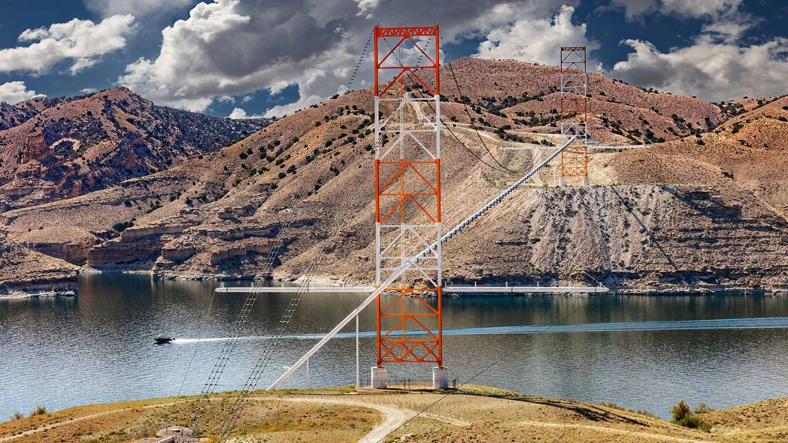 Flaming Gorge is preparing to be drained by up to a third to make up for the “horrible” Colorado River levels. Wyoming and other Upper Basin states could be left dry in response to desperate downriver water shortages. Above, power lines span Flaming Gorge Reservoir in Utah.