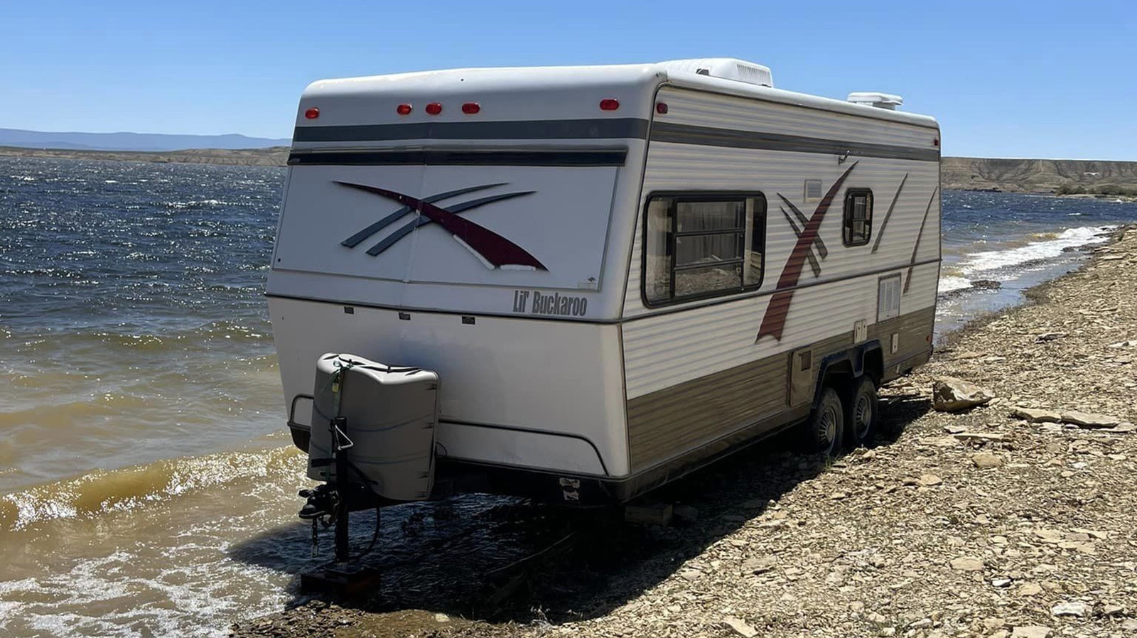 A camper parked on the beat at Flaming Gorge Reservoir.