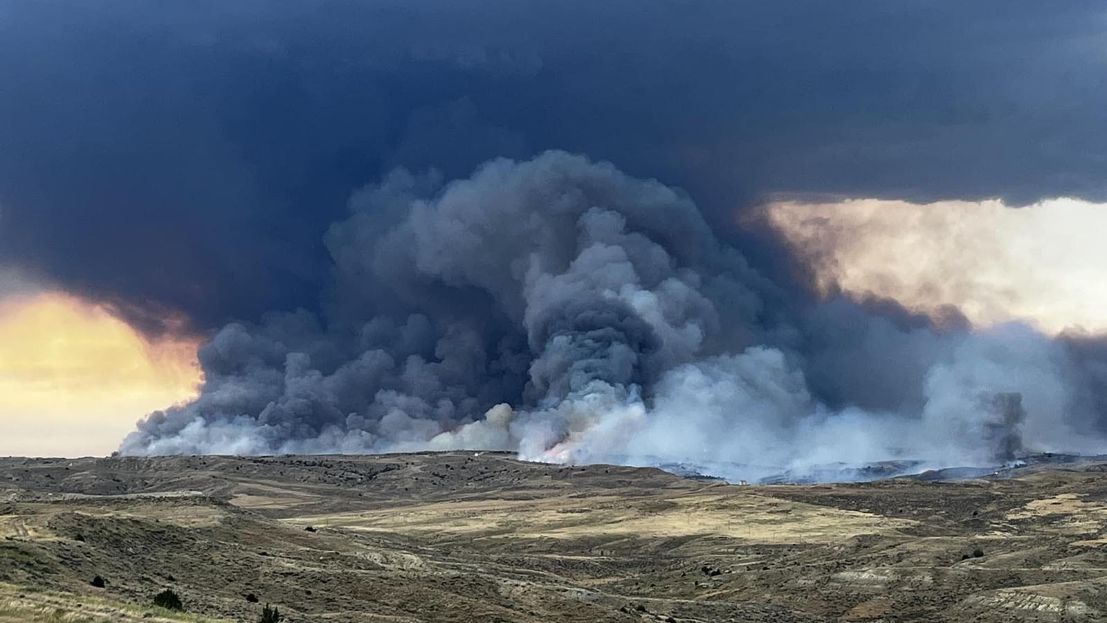 A dark mass of smoke rises from the Flat Rock Fire west of Gillette in Campbell County.